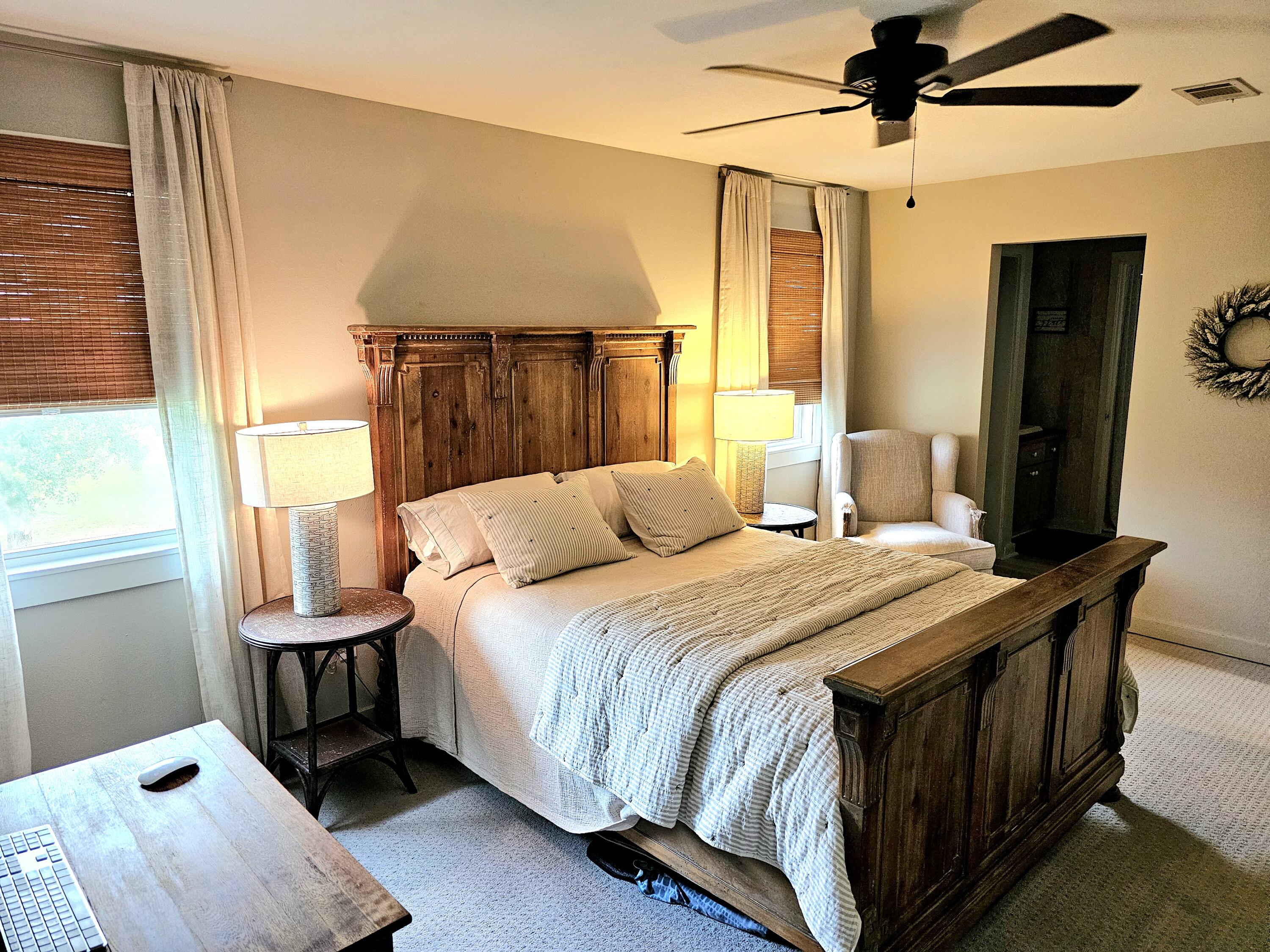 248 Blueberry Road Freeport, FL 32439 - Photo 24 of 37 a bedroom with a bed a window and potted plant