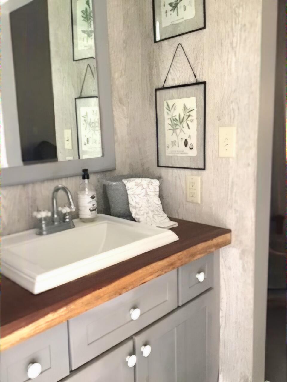 248 Blueberry Road Freeport, FL 32439 - Photo 27 of 37 a bathroom with a sink and a mirror