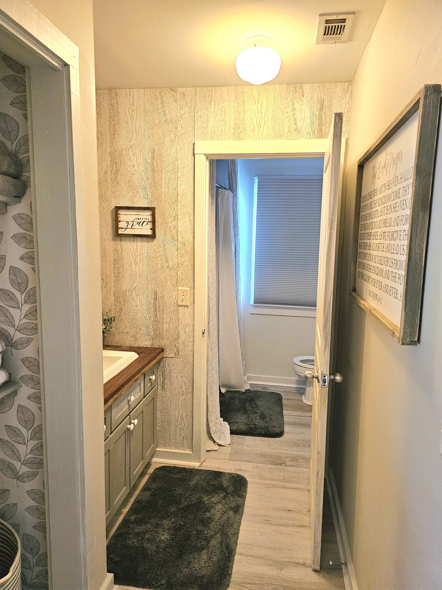 248 Blueberry Road Freeport, FL 32439 - Photo 28 of 37 a bathroom with a sink a mirror and a shower