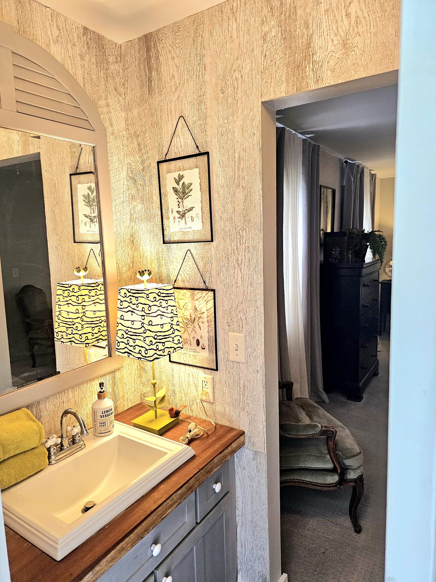 248 Blueberry Road Freeport, FL 32439 - Photo 31 of 37 a bathroom with a sink and a mirror