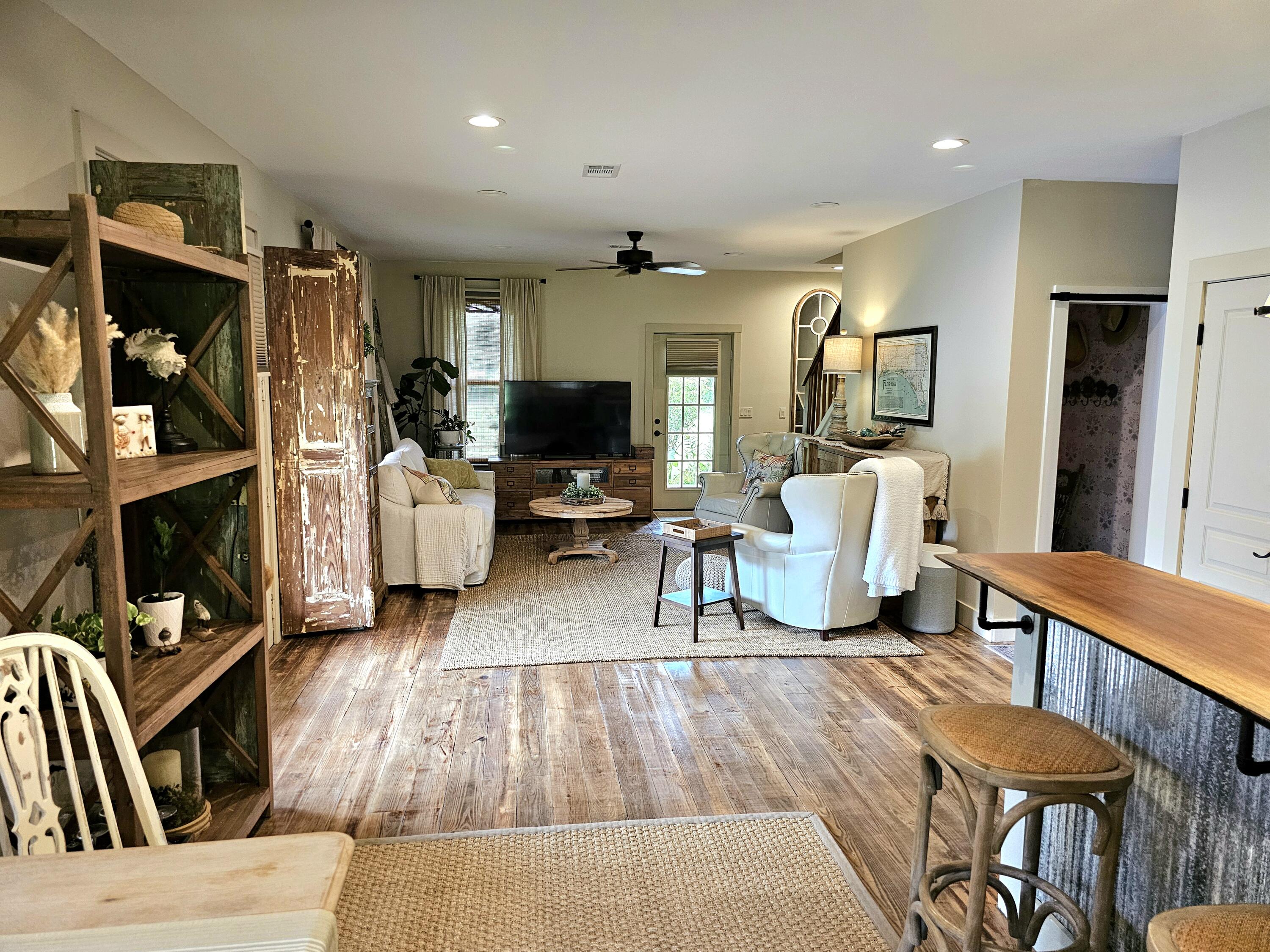248 Blueberry Road Freeport, FL 32439 - Photo 9 of 37 a living room with furniture and a flat screen tv