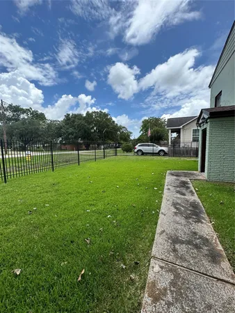 a view of a park with large trees