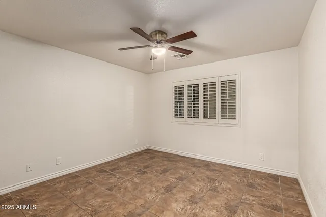 an empty room with fan