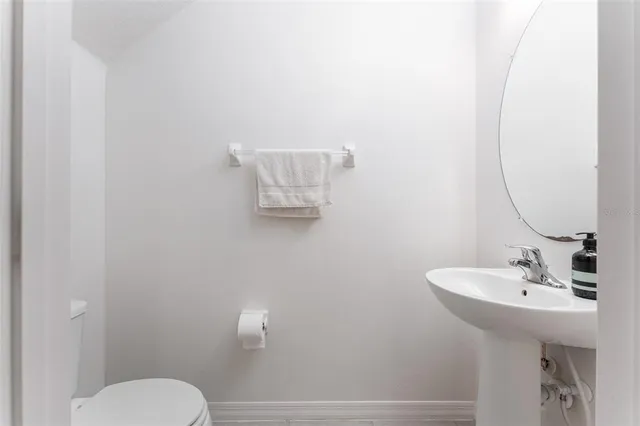 a bathroom with a sink and mirror