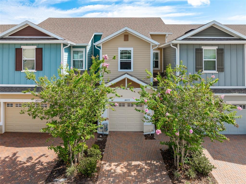 14072 Kite Lane Lithia, FL 33547 - Photo 2 of 25 a front view of a house with a yard and trees