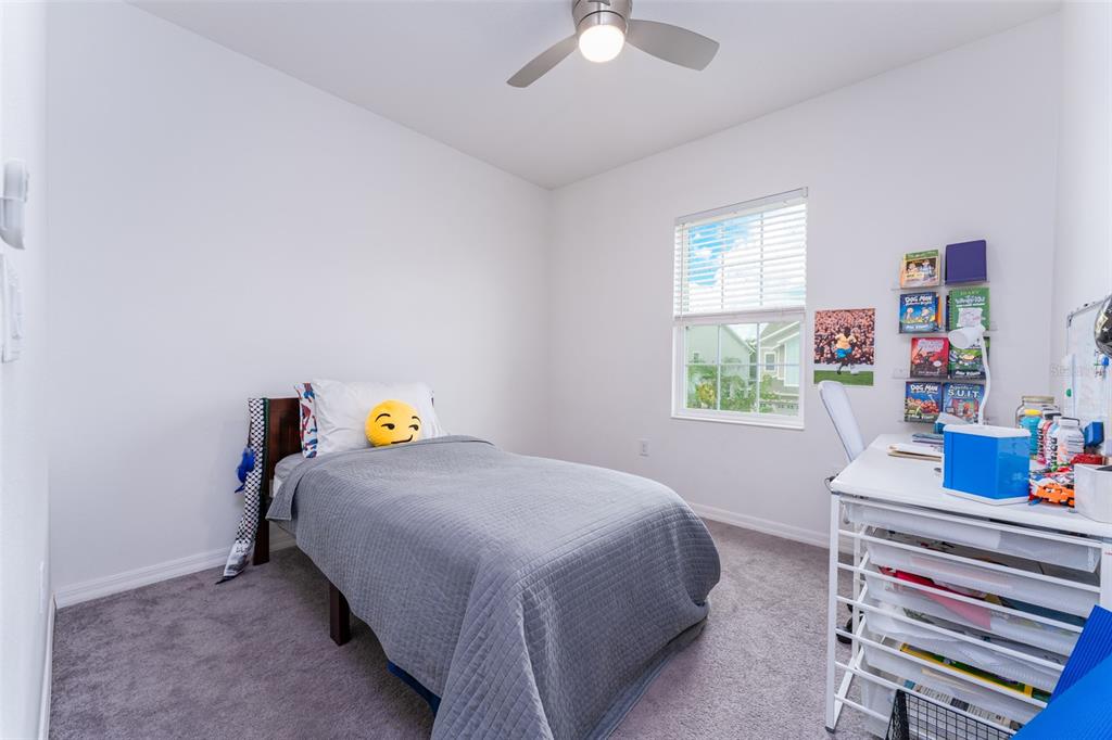 14072 Kite Lane Lithia, FL 33547 - Photo 21 of 25 a bedroom with a bed and a window