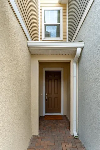 an entrance to house with yard