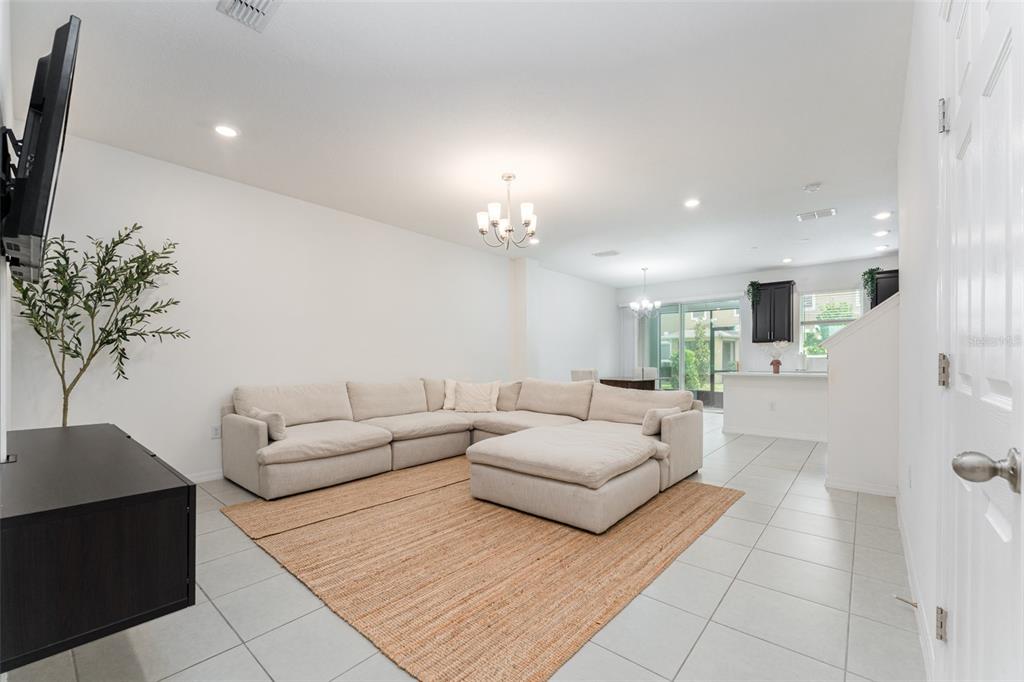 14072 Kite Lane Lithia, FL 33547 - Photo 7 of 25 a living room with furniture and a chandelier