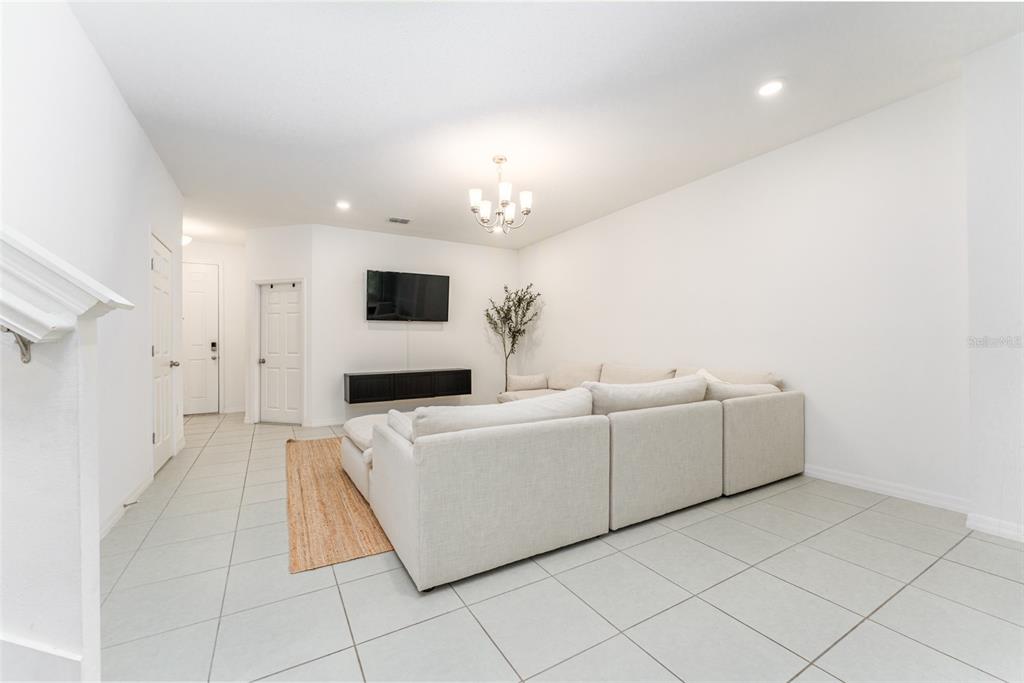 14072 Kite Lane Lithia, FL 33547 - Photo 9 of 25 a living room with furniture and a flat screen tv