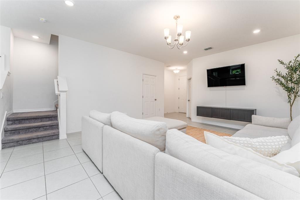 14072 Kite Lane Lithia, FL 33547 - Photo 10 of 25 a living room with furniture and a flat screen tv