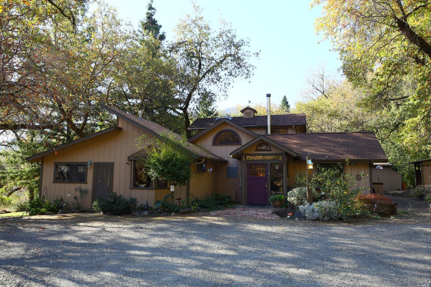 2500 McNab Ranch Road Ukiah, CA 95482 - Photo 1 of 1 a front view of a house with a garden