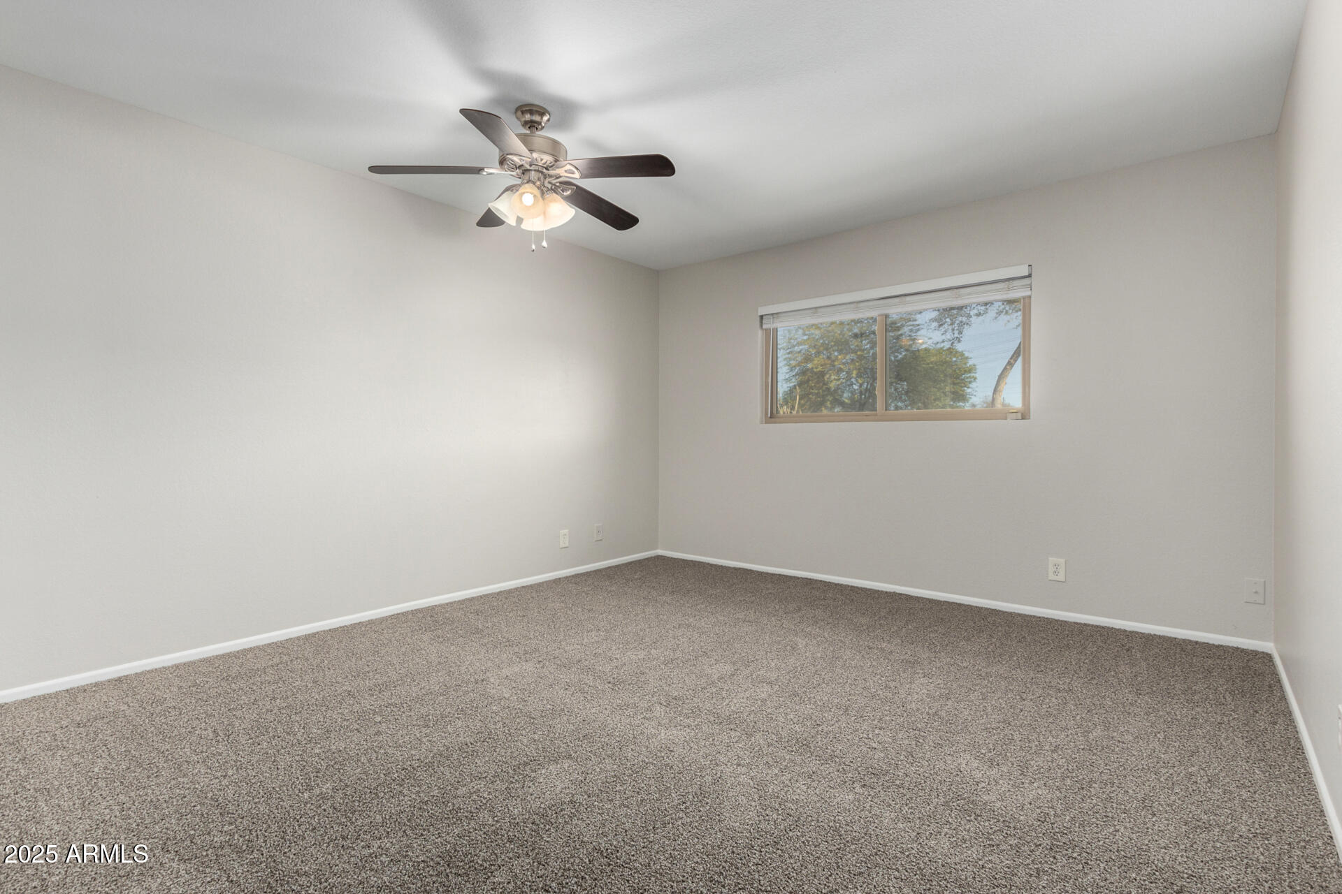 2201 South Evergreen Road Tempe, AZ 85282 - Photo 17 of 42 a view of an empty room with a window