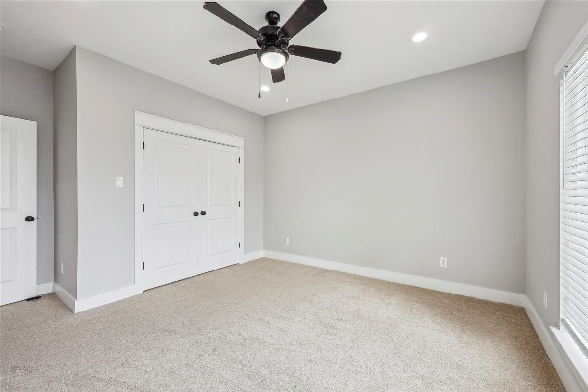 7722 Pond Circle Beaumont, TX 77707 - Photo 32 of 42 an empty room with a window and a fan