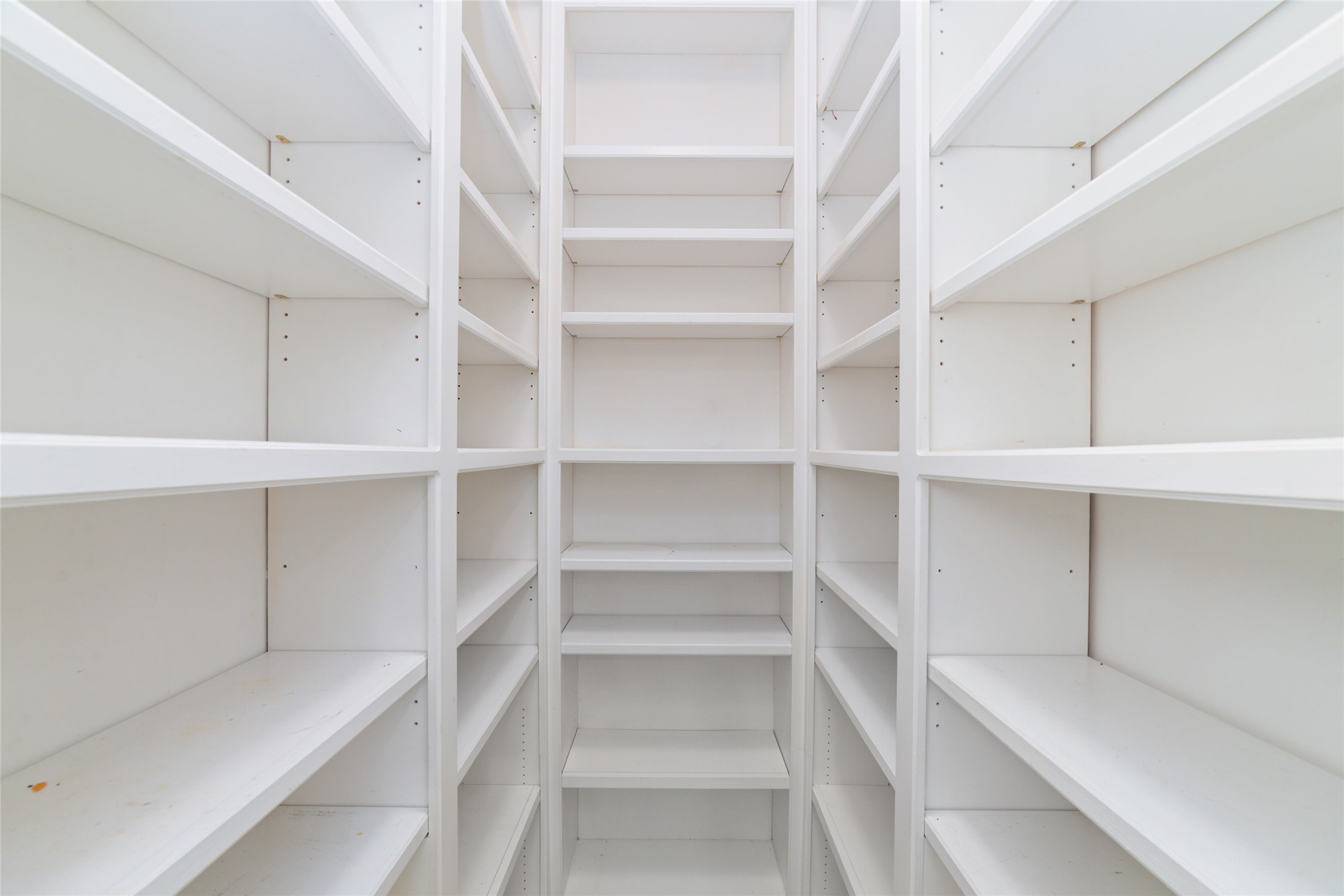 16114 Lafone Drive Spring, TX 77379 - Photo 13 of 45 Everyone’s dream...a HUGE walk-in primary closet with abundant built-in shelving and plenty of room to keep everything organized!