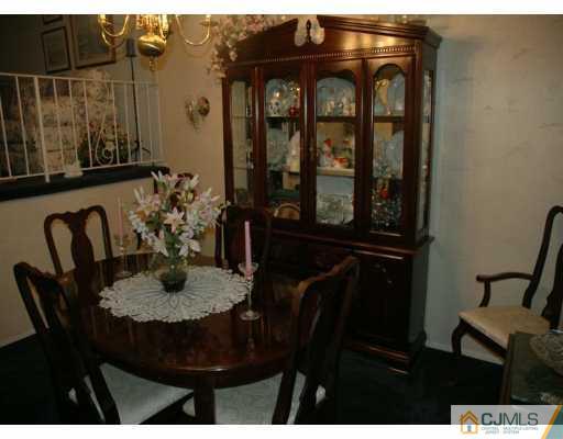 6 Magee Road Edison, NJ 08817 - Photo 3 of 8 a view of a dining room with furniture and window