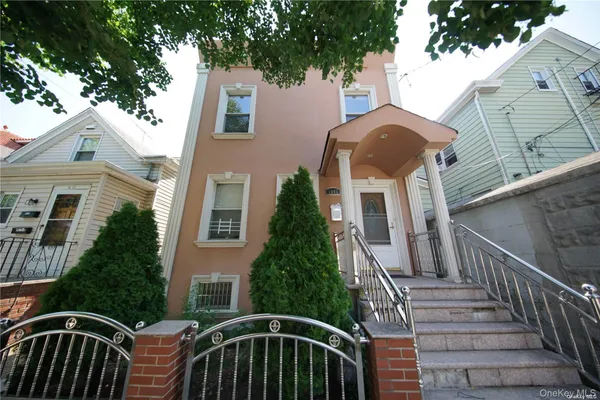 a view of a brick house with a large windows