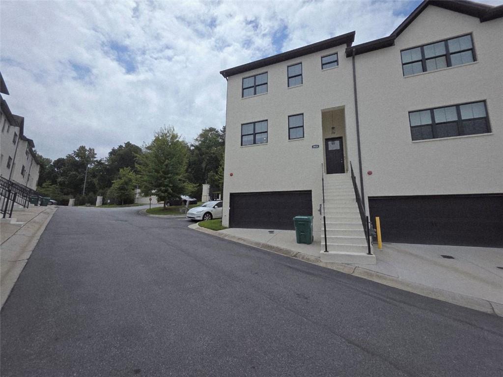 8020 Linfield Way Atlanta, GA 30350 - Photo 1 of 1 a view of a street with big house