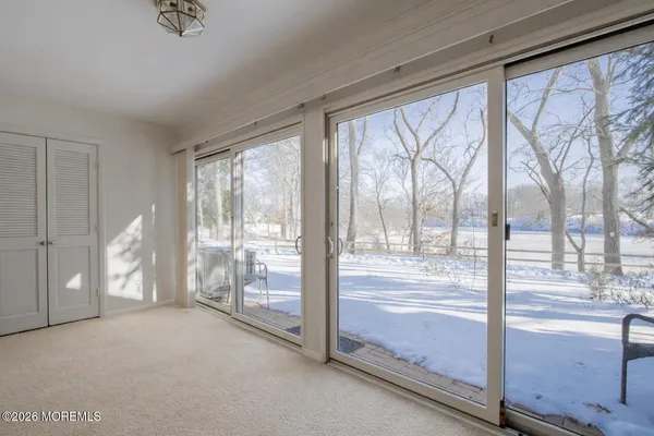 a view of empty room with floor to ceiling window