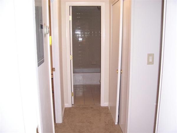 A3 Colonial Drive, Unit 2 Andover, MA 01810 - Photo 6 of 11 a view of a bathroom from a hallway