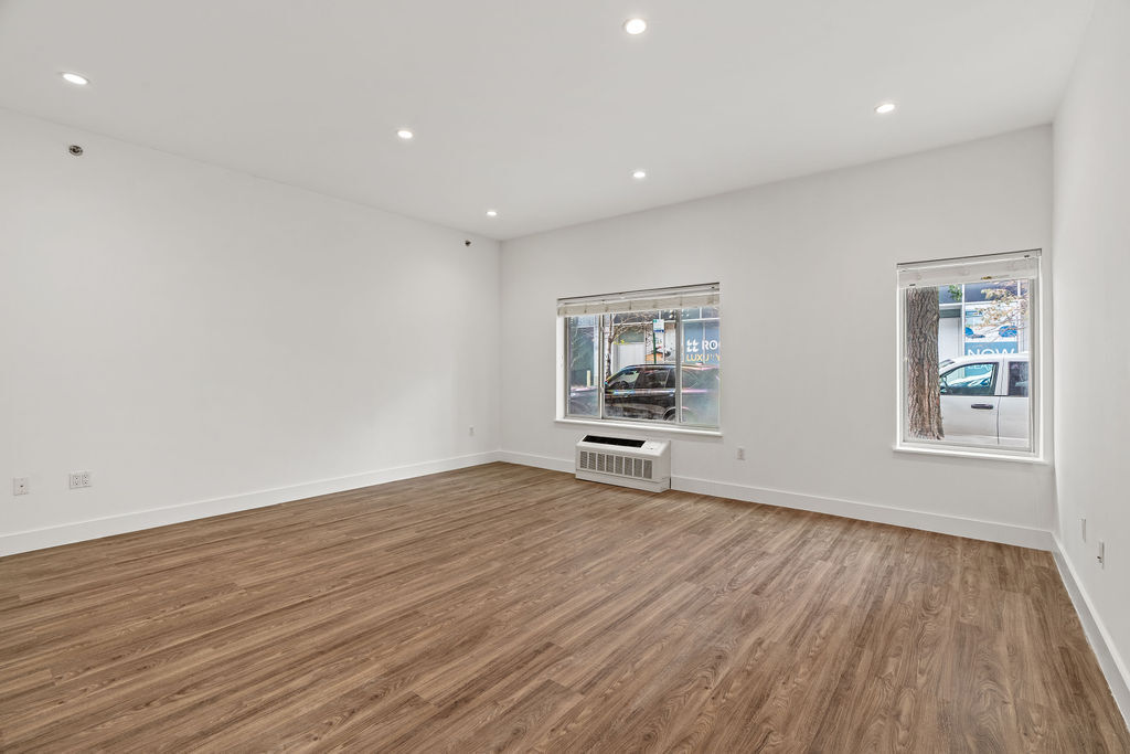 Undisclosed Address Queens, NY 11101 - Photo 13 of 21 a view of room with window and wooden floor