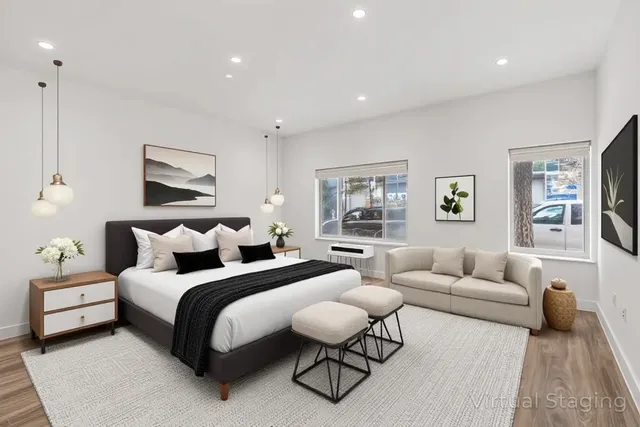 a bedroom with bed and a couch