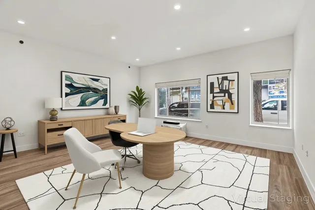 a dining room with furniture and window