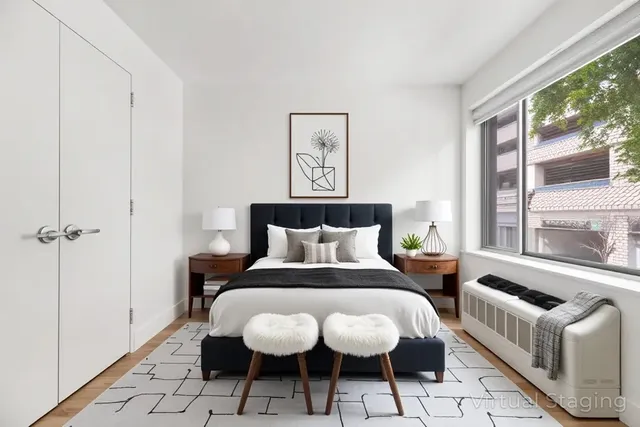 a bed room with a bed and a window