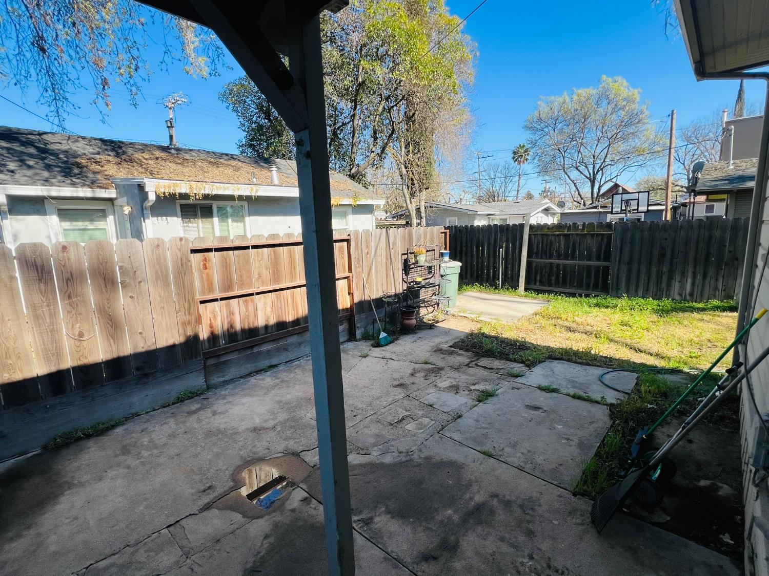 612 16th Street Modesto, CA 95354 - Photo 9 of 19 fenced backyard with a patio area of the front house