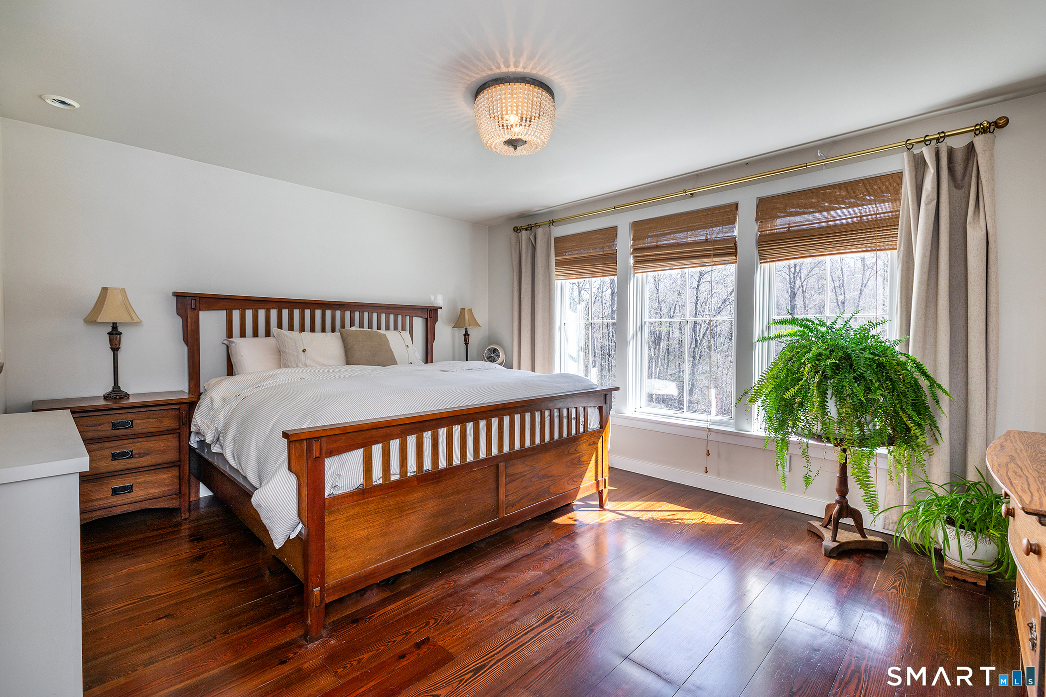 9 Old Paddock Lane Kent, CT 06785 - Photo 20 of 28 a bedroom with furniture and a potted plant