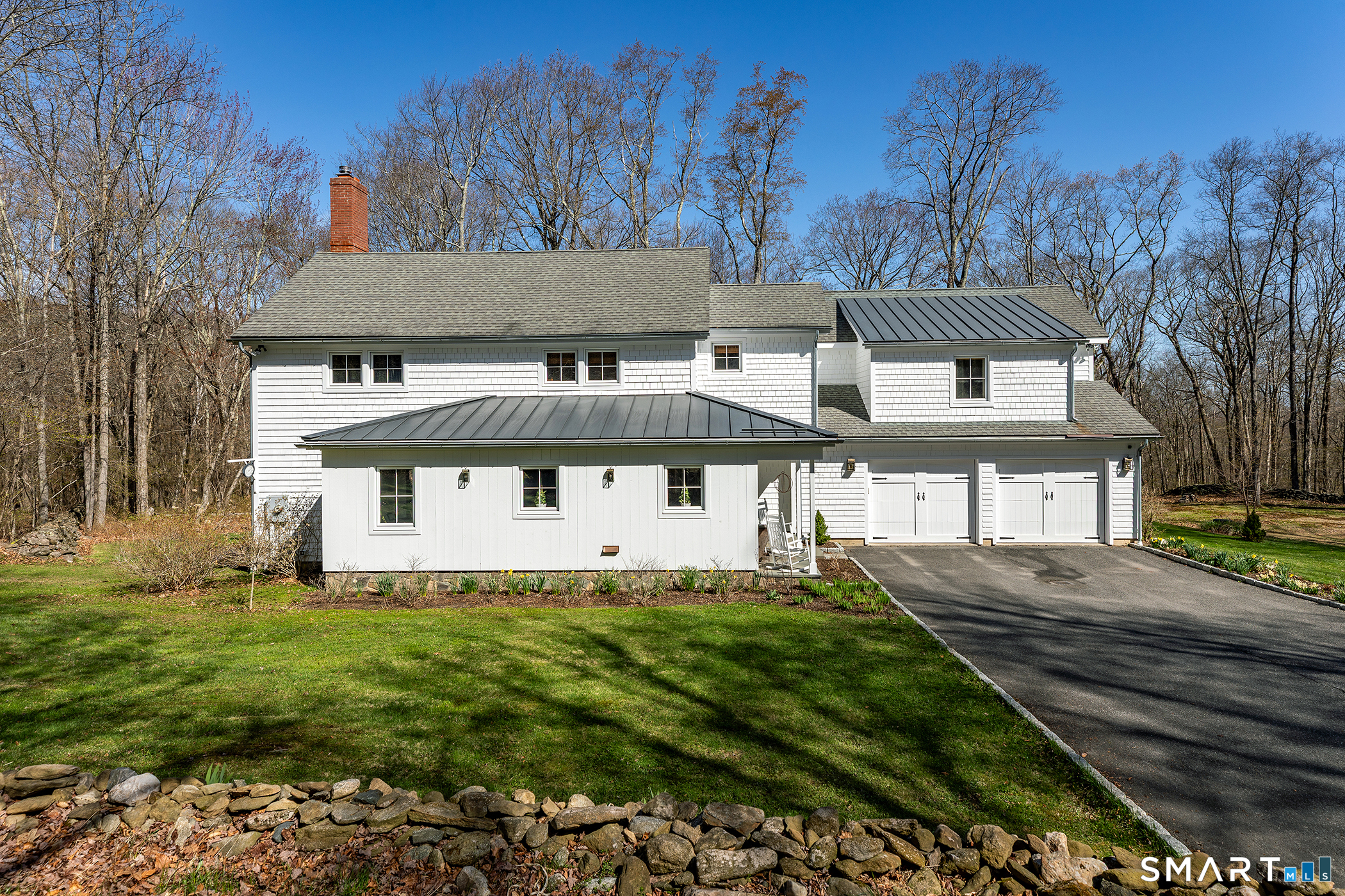 9 Old Paddock Lane Kent, CT 06785 - Photo 2 of 28 a front view of a house with a yard