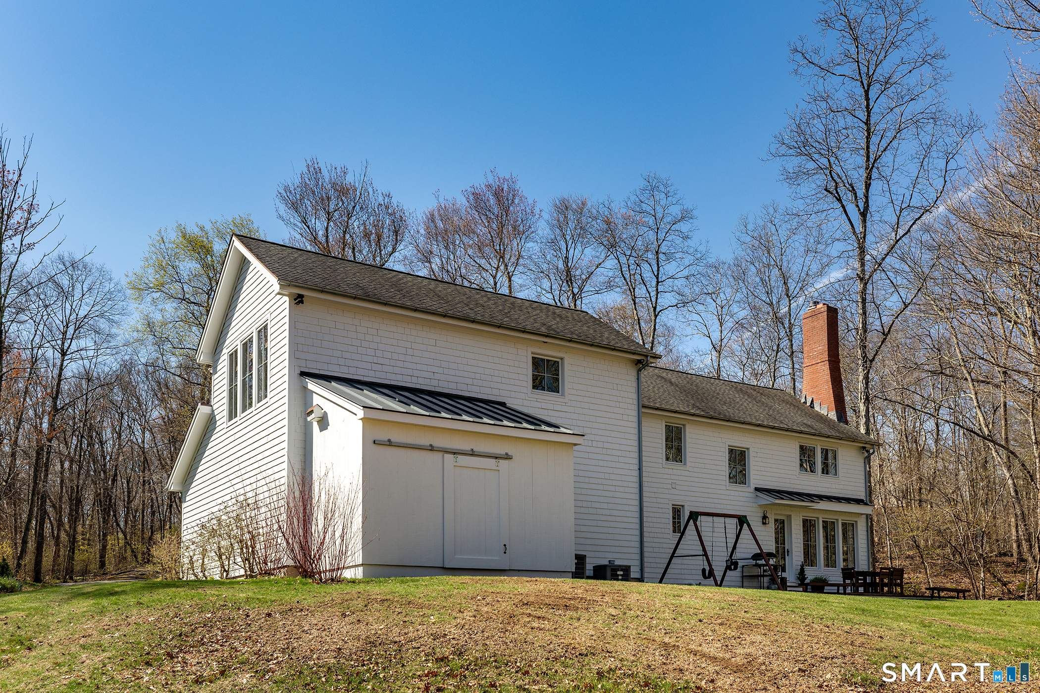 9 Old Paddock Lane Kent, CT 06785 - Photo 26 of 28 a front view of a house with a yard