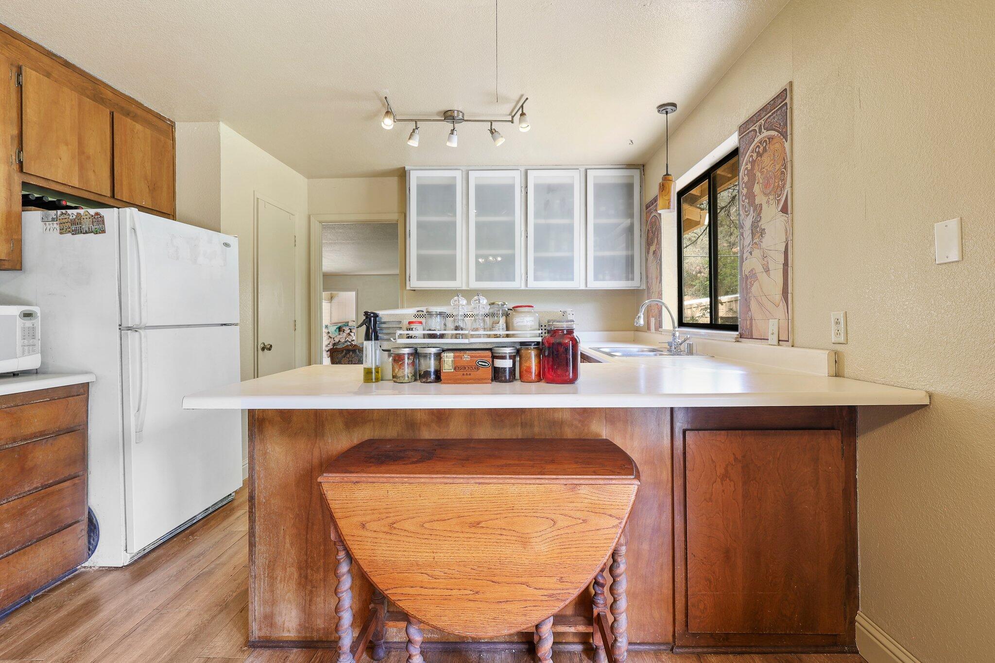 7741 Placer Road Redding, CA 96001 - Photo 15 of 24 a dining table with chairs and window