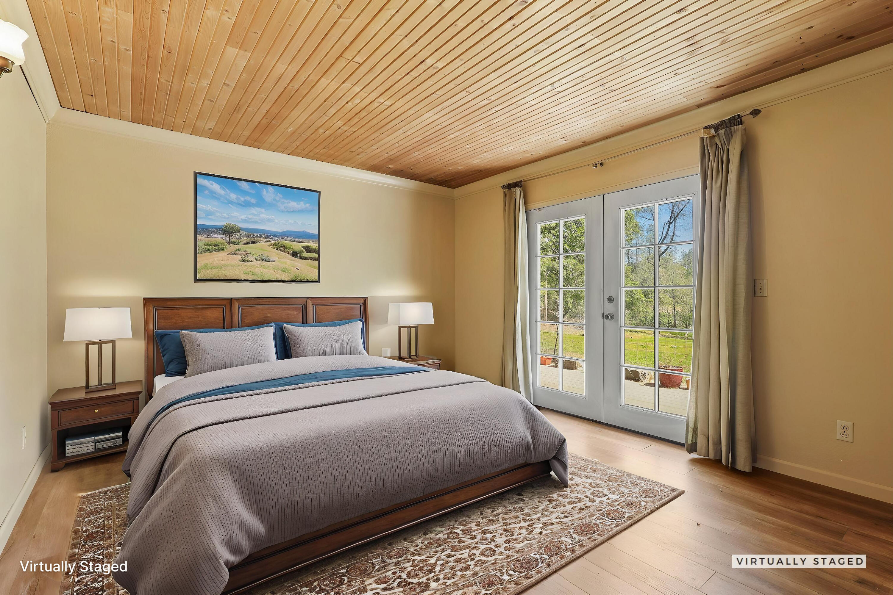 7741 Placer Road Redding, CA 96001 - Photo 19 of 24 a spacious bedroom with a large bed and a window