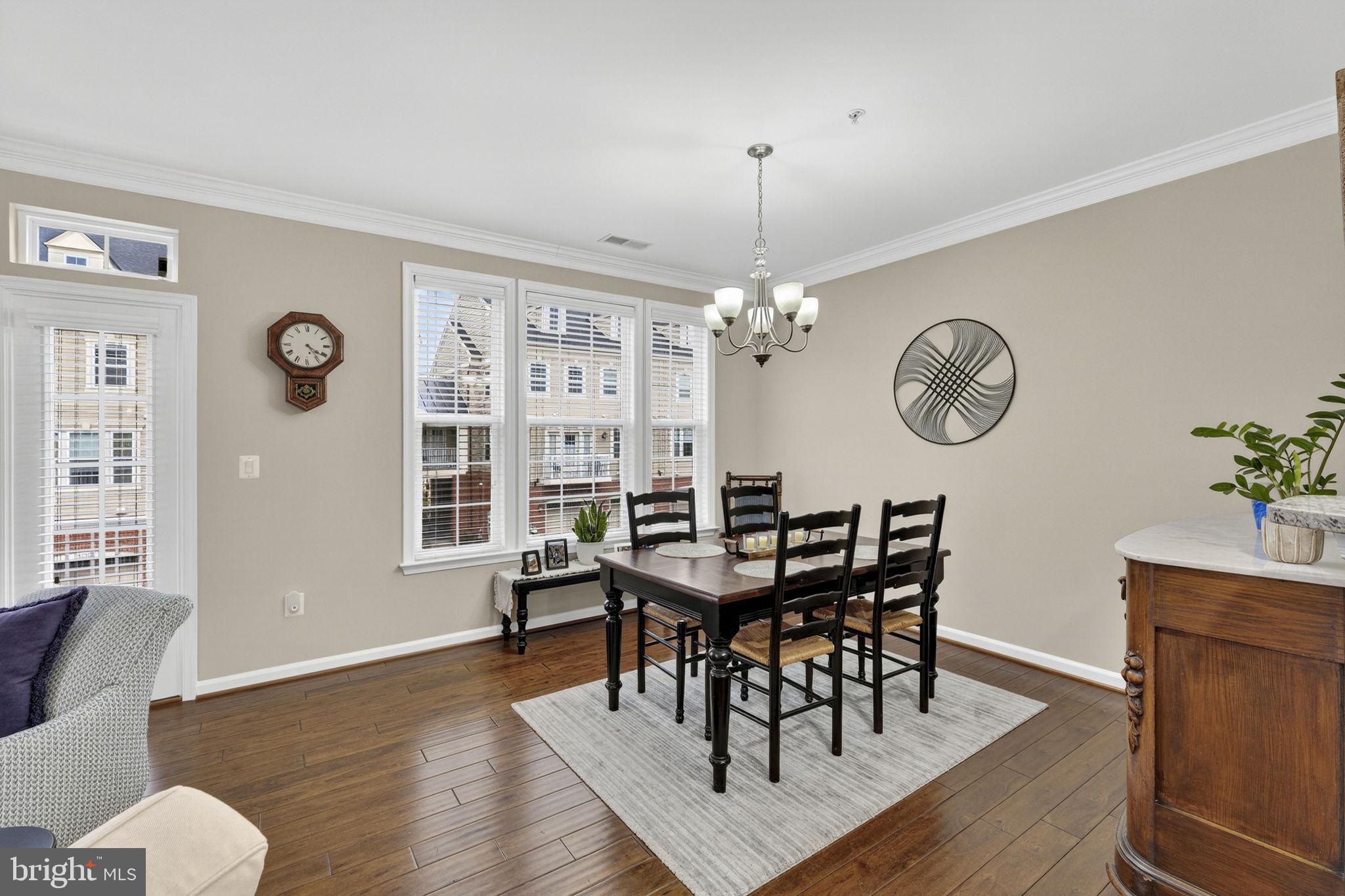 42558 Sunset Ridge Square Ashburn, VA 20148 - Photo 21 of 51 a view of a dining room with furniture window and wooden floor
