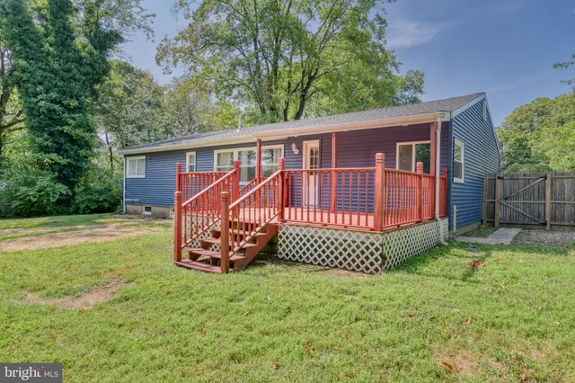 a view of a deck with a yard