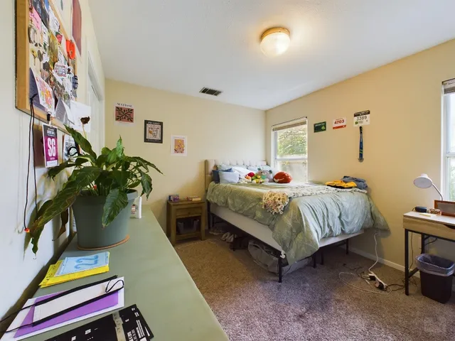 a bathroom with a sink mirror and vanity