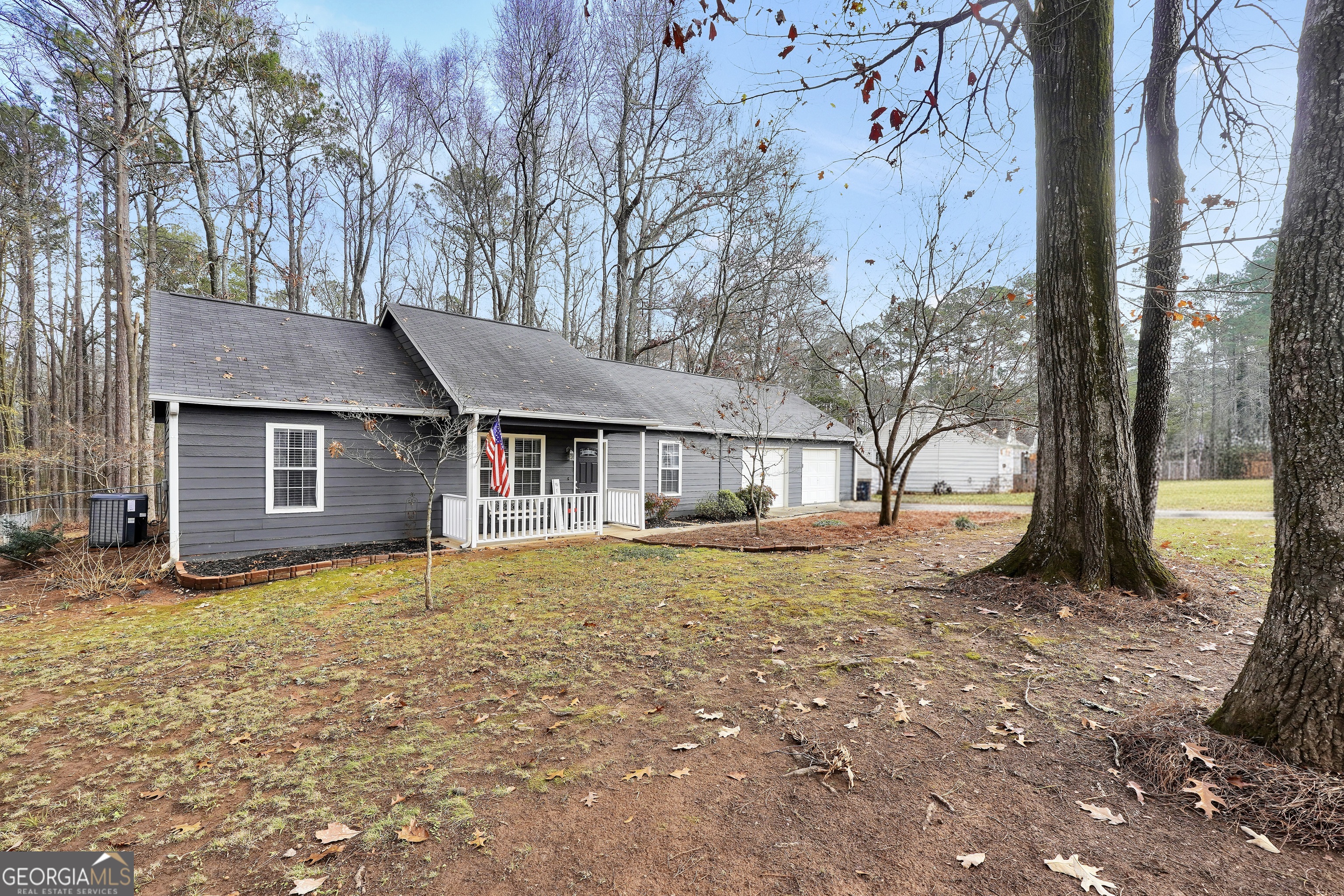 145 Old Highway 85 Senoia, GA 30276 - Photo 1 of 40 a front view of a house with a yard