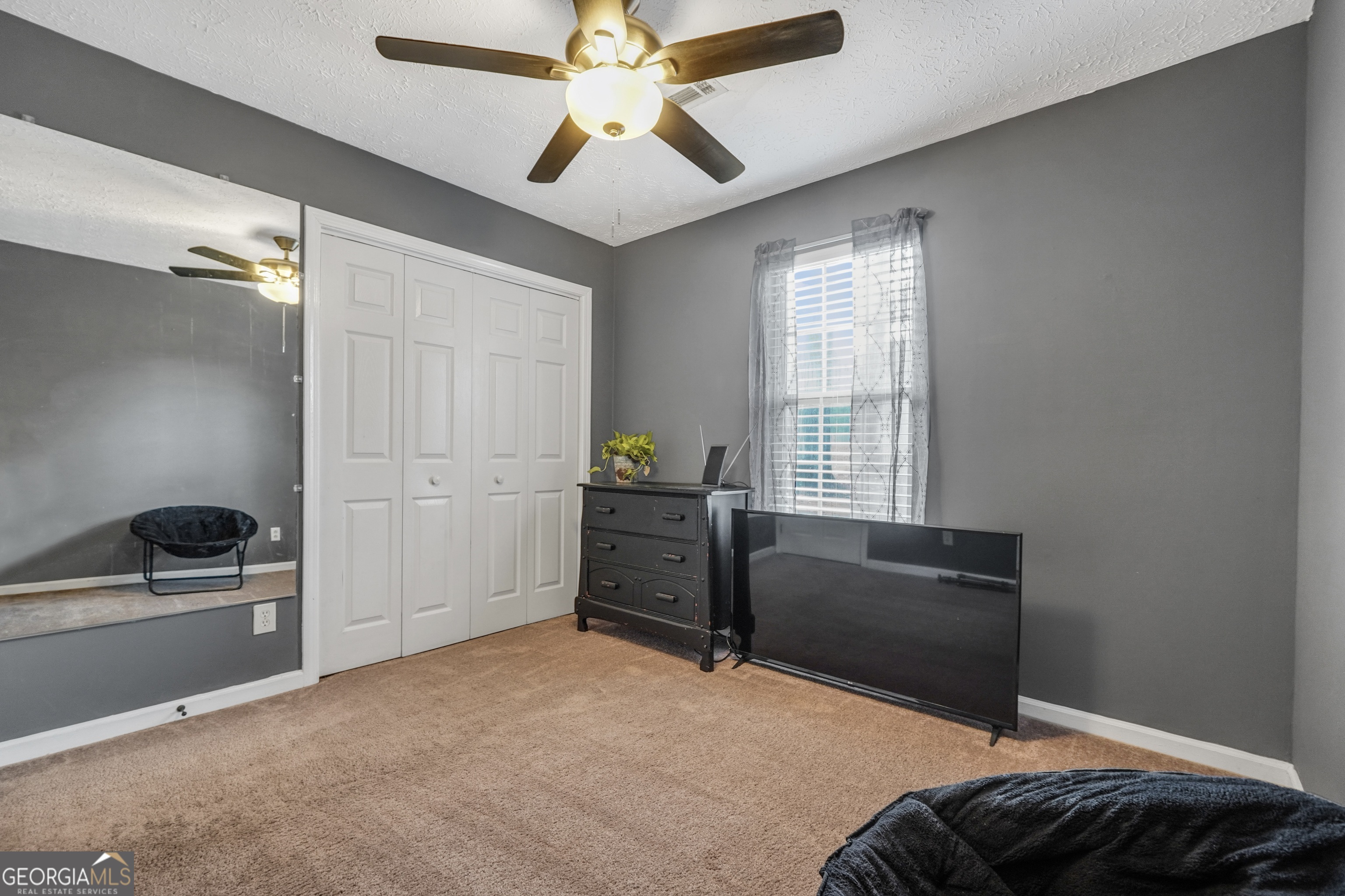 145 Old Highway 85 Senoia, GA 30276 - Photo 15 of 40 a bedroom with a bed and a window