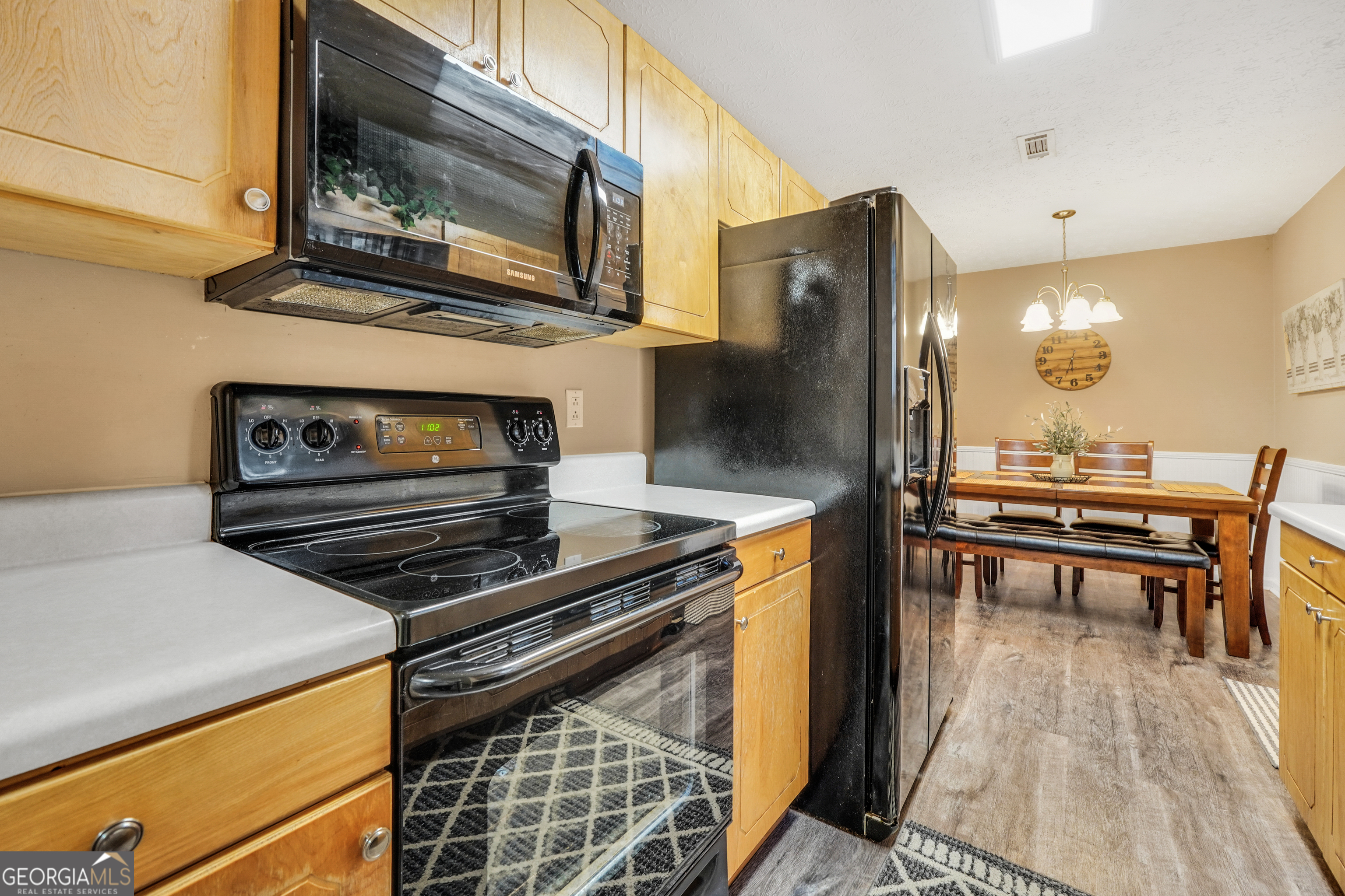 145 Old Highway 85 Senoia, GA 30276 - Photo 18 of 40 a kitchen with appliances and cabinets