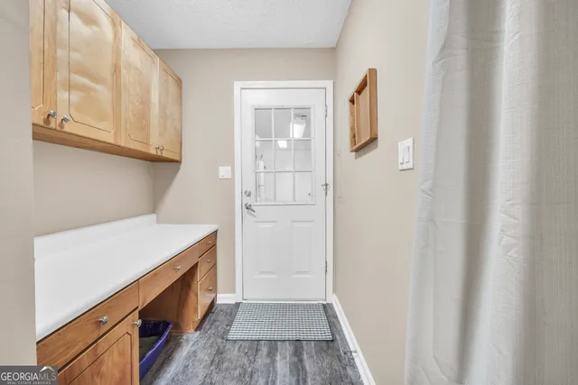 a white toilet sitting next to a shower curtain