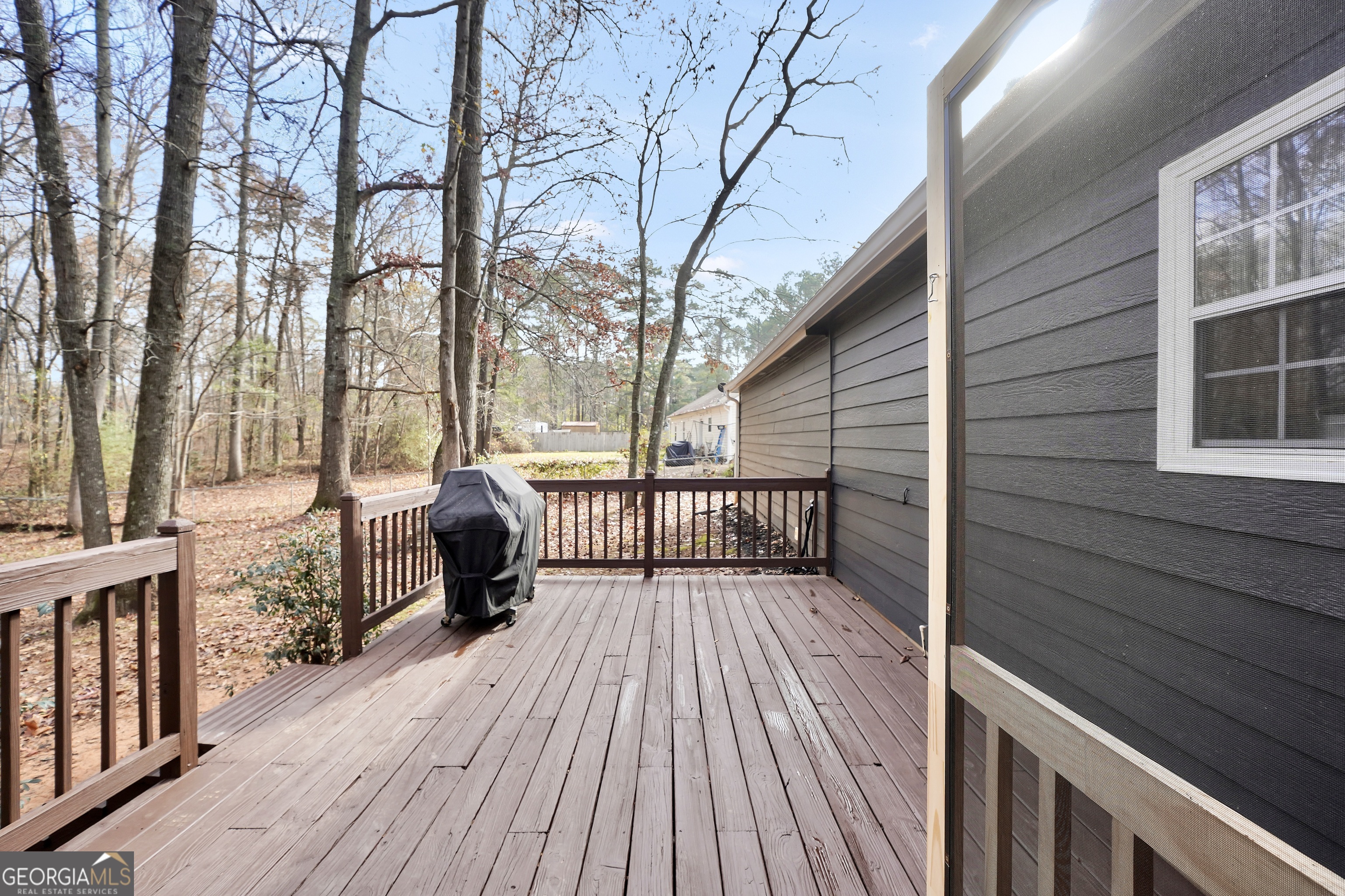 145 Old Highway 85 Senoia, GA 30276 - Photo 31 of 40 a view of a wooden deck with a yard