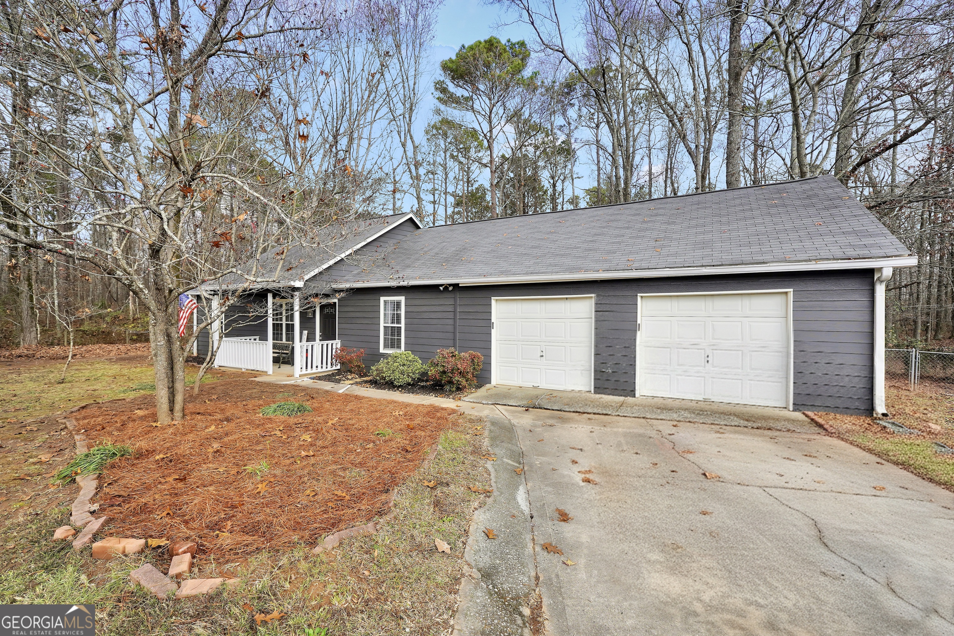 145 Old Highway 85 Senoia, GA 30276 - Photo 35 of 40 a front view of a house with a yard and garage