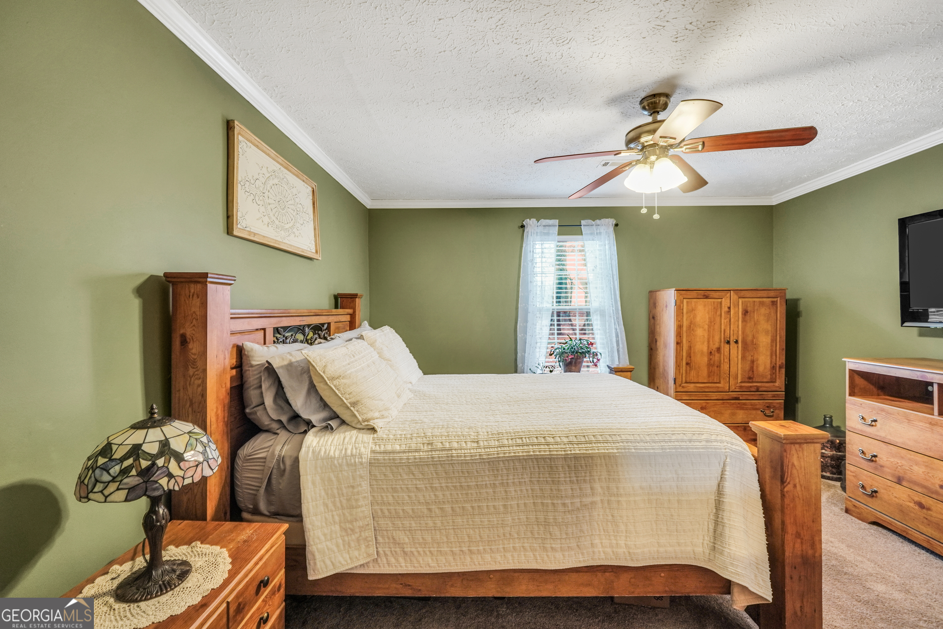 145 Old Highway 85 Senoia, GA 30276 - Photo 8 of 40 a bedroom with a bed and wooden floor