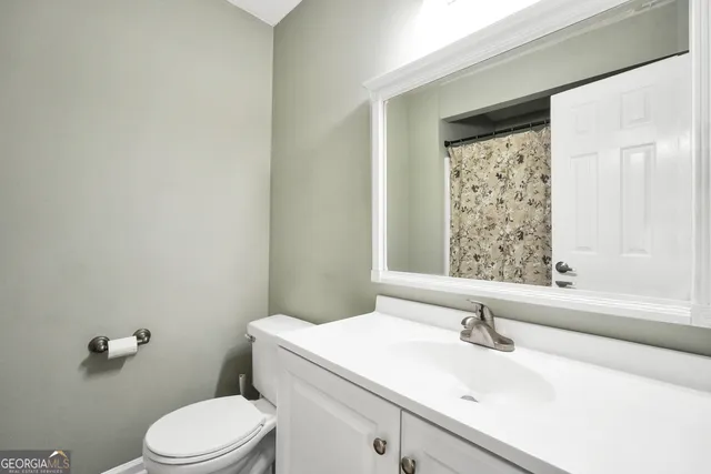 a bathroom with a sink a toilet and tub