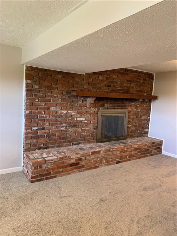 3124 Haberlein Road Gibsonia, PA 15044 - Photo 14 of 16 Lower level wood burning fireplace with beautiful brick hearth