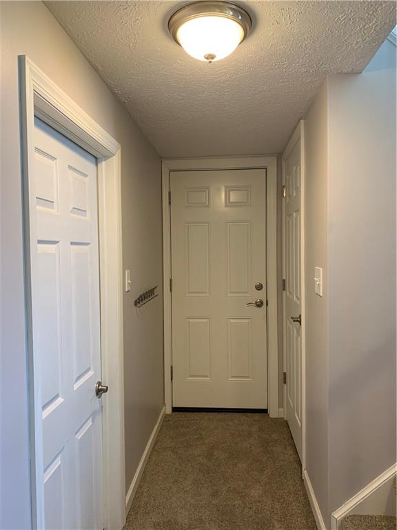 3124 Haberlein Road Gibsonia, PA 15044 - Photo 16 of 16 Door to garage, laundry room on left, storage area on right.