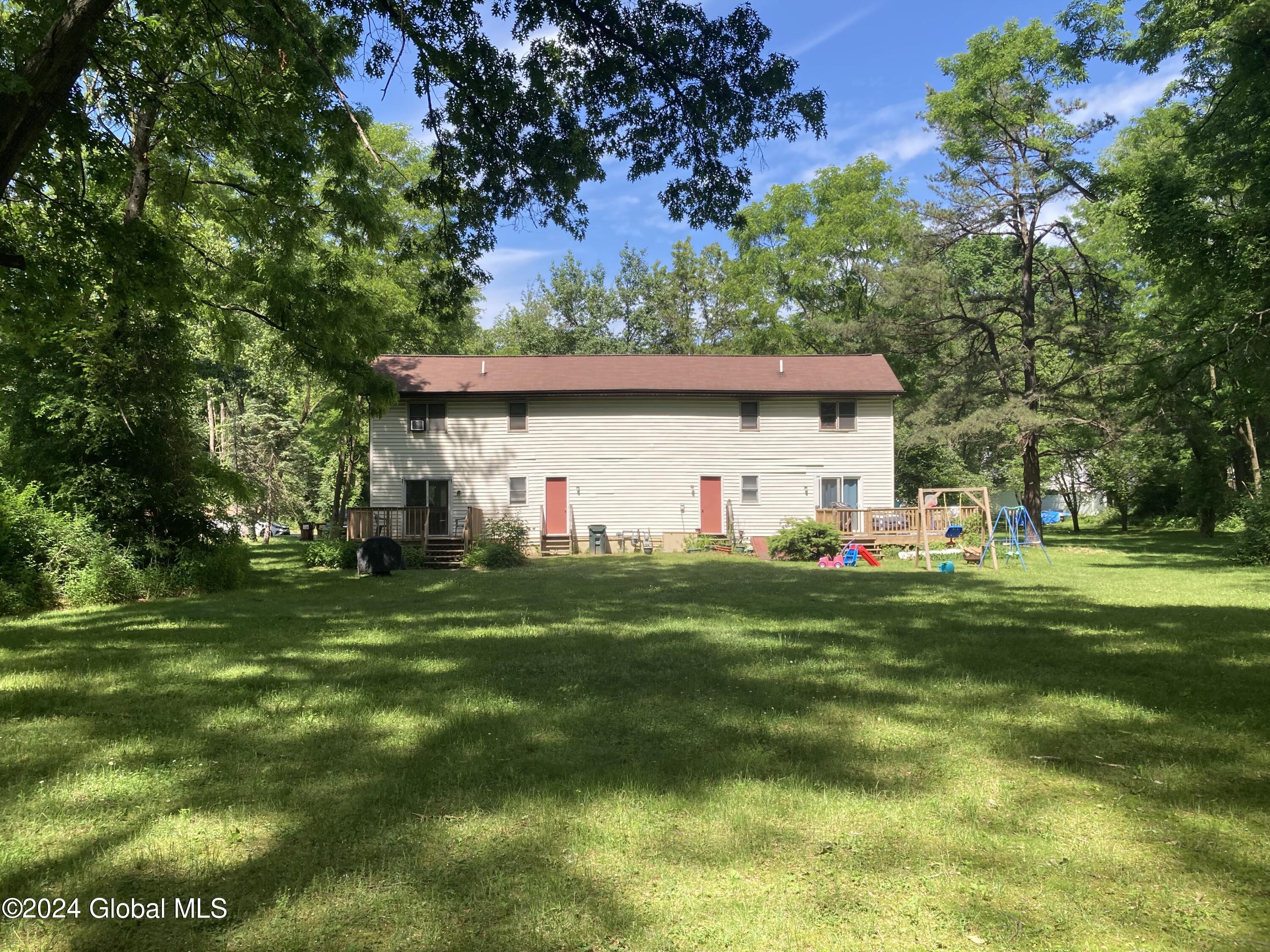 5942 Curry Rd Extension Guilderland, NY 12303 - Photo 2 of 18 back of home