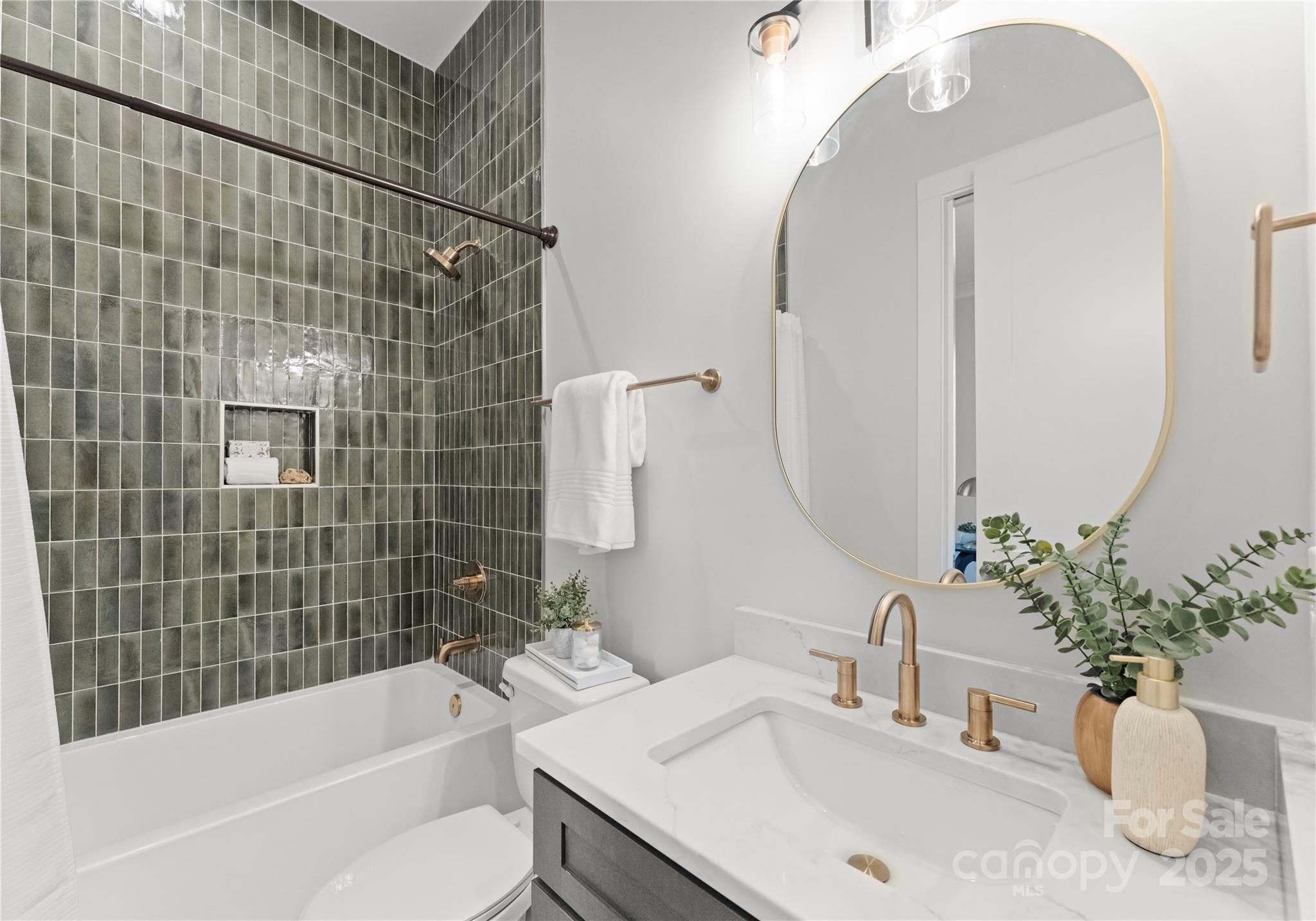 19405 Coachmans Trace Cornelius, NC 28031 - Photo 11 of 44 a bathroom with a granite countertop sink a toilet and bathtub