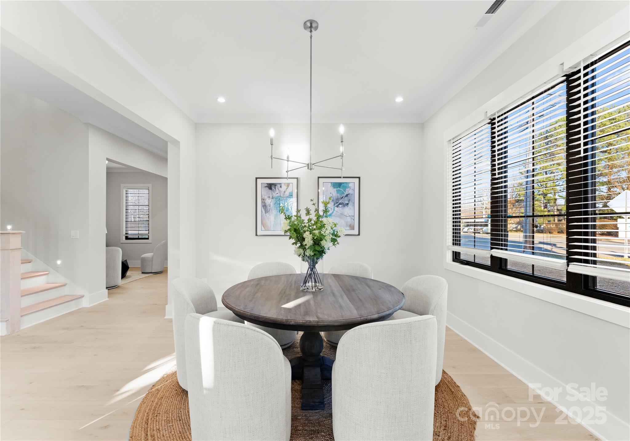 19405 Coachmans Trace Cornelius, NC 28031 - Photo 12 of 44 a view of a dining room with furniture and a chandelier