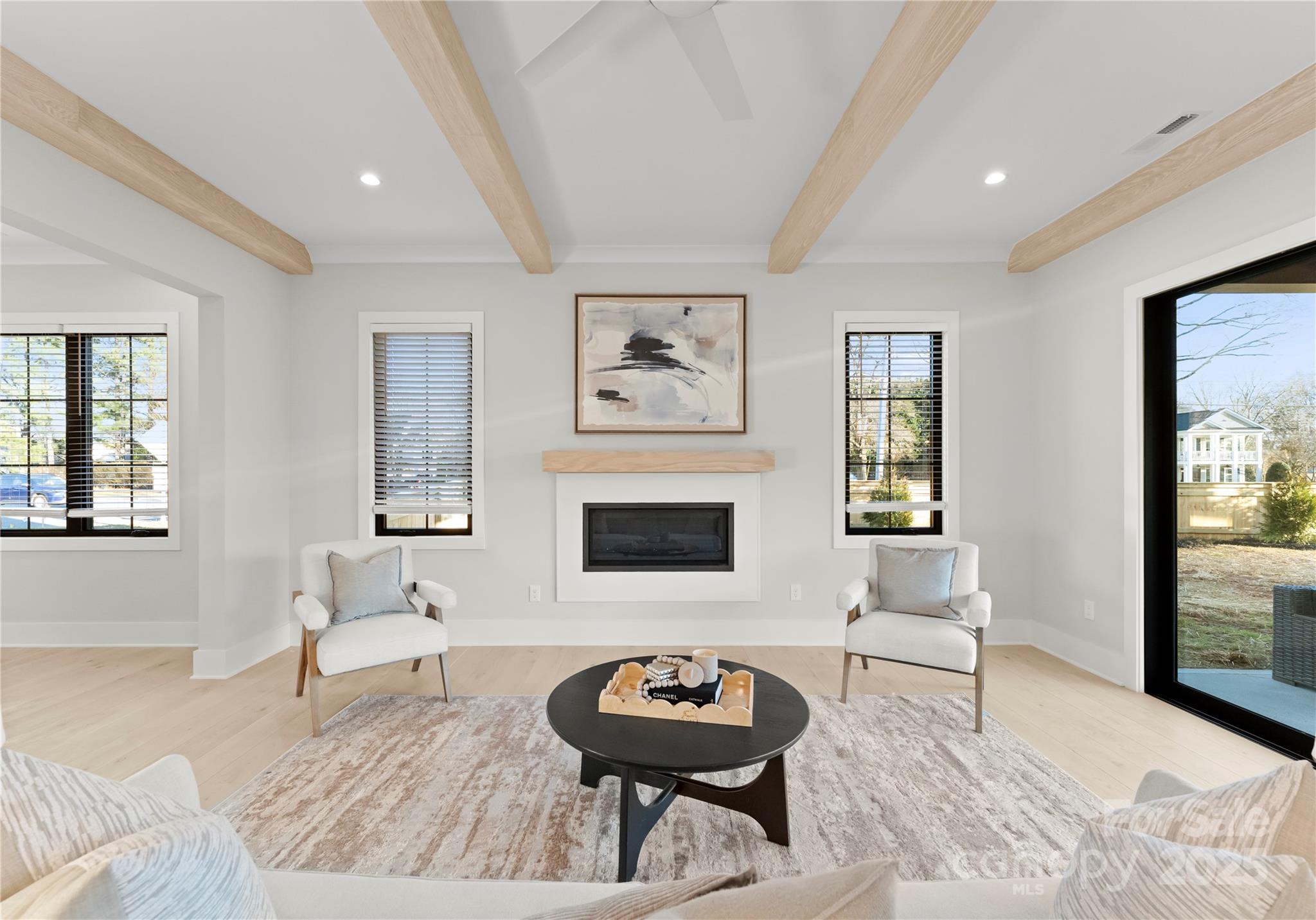 19405 Coachmans Trace Cornelius, NC 28031 - Photo 14 of 44 a living room with furniture and a fireplace